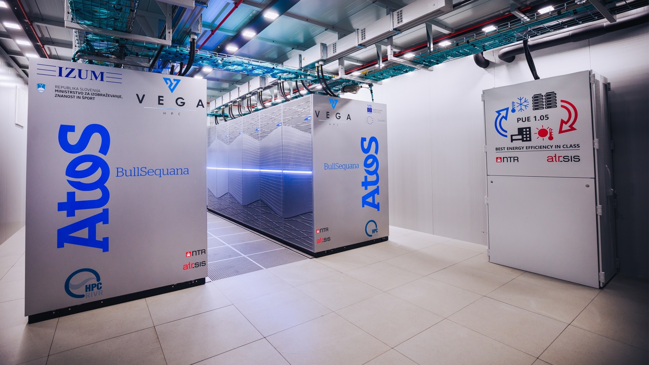 VEGA supercomputer and Atos BullSequana cabinets in a bright data centre environment.