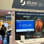 A booth in SC with a screen showing the epicure logo.