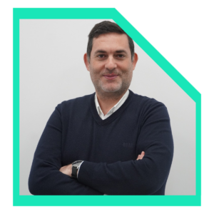 Men wearing a black sweater with arms crossed.