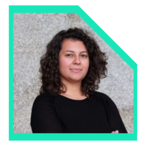 Woman wearing a black shirt with arms crossed.