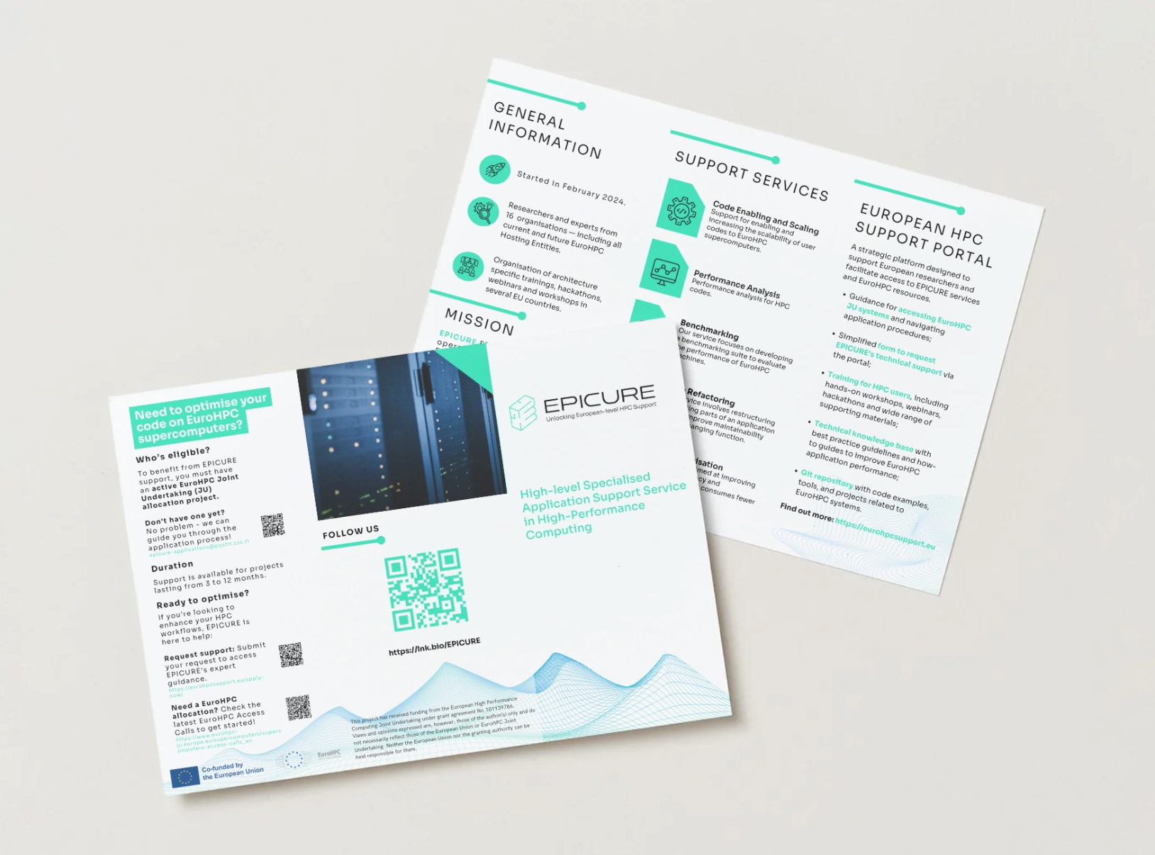 A white three-part flyer opened on a wooden table.