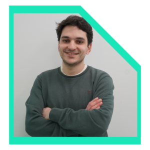 Men in a green sweater with arms-crossed.