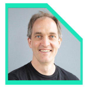 Men wearing a black t-shirt smiling