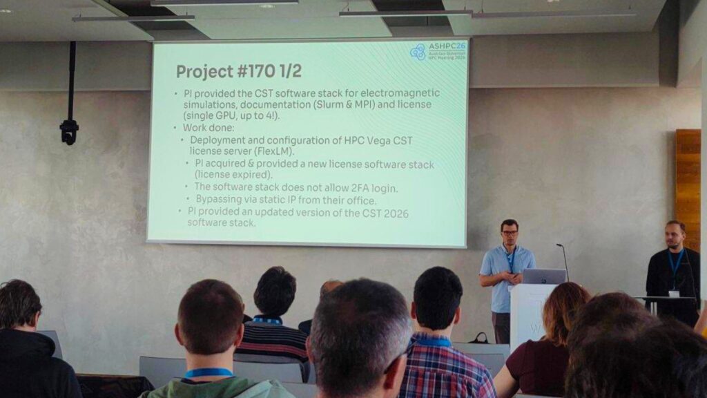 A speaker presents a technical case study on software deployment and licensing challenges during an EPICURE session at the Austrian-Slovenian HPC Meeting 2026.