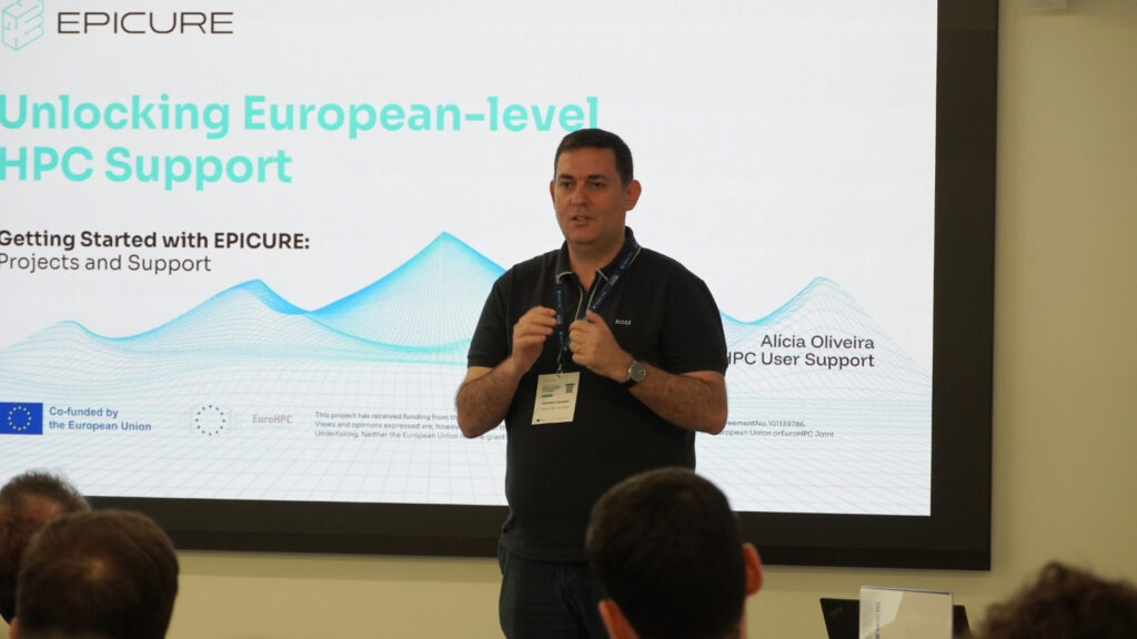 Speaker presenting an introduction to EPICURE services during an HPC workshop, standing in front of a slide on European-level HPC support.