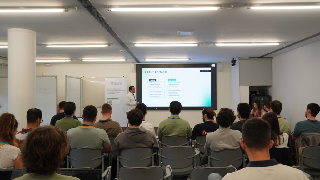 Audience attending a presentation on HPC in Portugal, with a speaker presenting slides at the front of a classroom-style workshop.