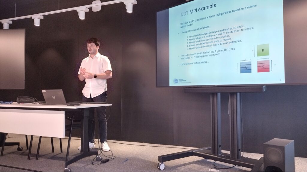 A presenter explains an MPI matrix multiplication example during the High-Scalability Workshop on MareNostrum 5.