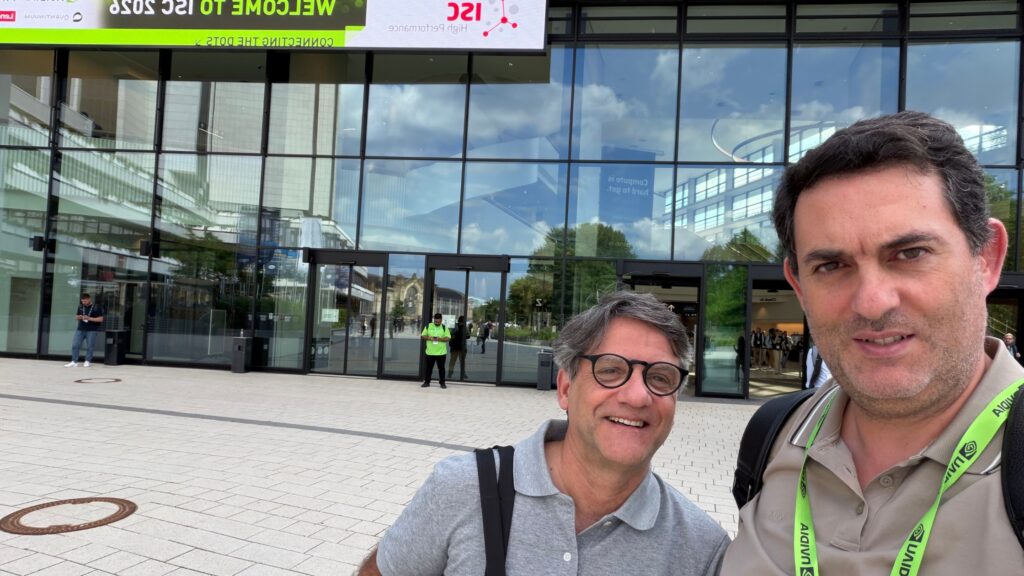 Two men outside the ISC High Performance 2026 venue in Hamburg, ahead of the conference dedicated to HPC, AI, and scientific computing.